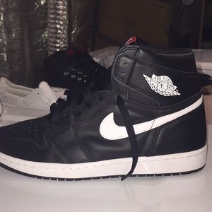 white and black jordan 1’s